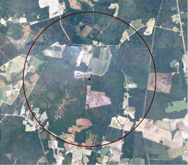 Aerial view of parcels of land with radius circle marked