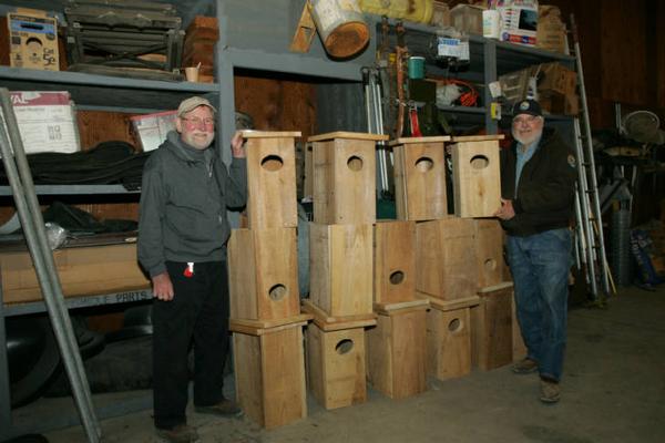Photo of volunteers with new wood boxes