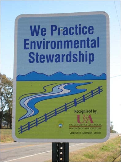 Sign reads: We Practice Environmental Stewardship Recognized by University of Arkansas