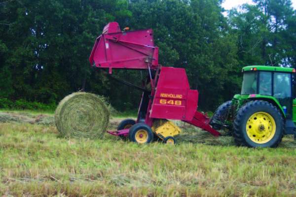 Decorative cover image of tractor with hay baler