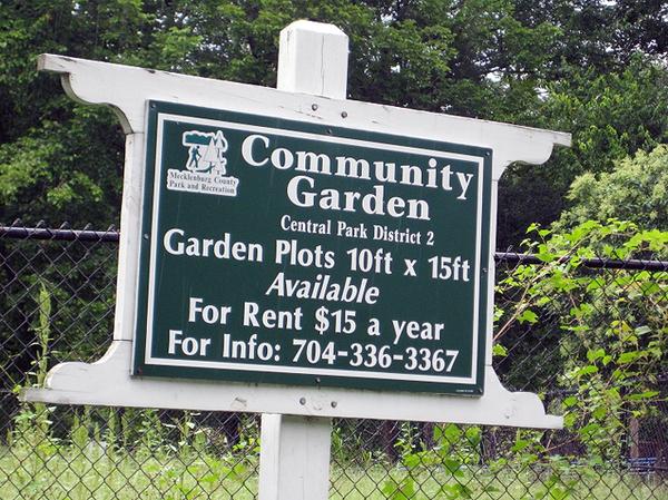 Photo of a community garden welcome sign