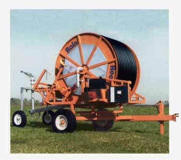 Orange Hard Hose Traveler (trailer with large hose reel).