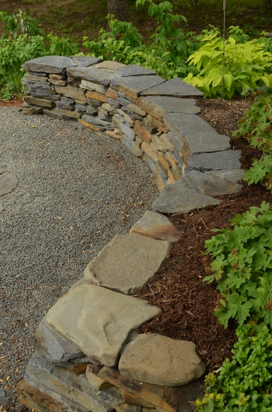 stone retaining wall that doubles as a seating option