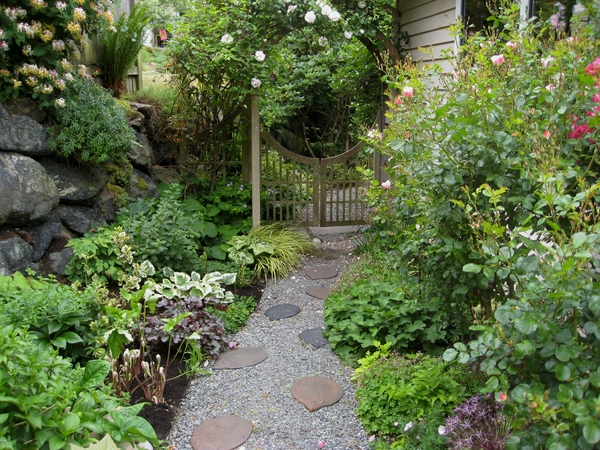 lush garden with path leading to gate