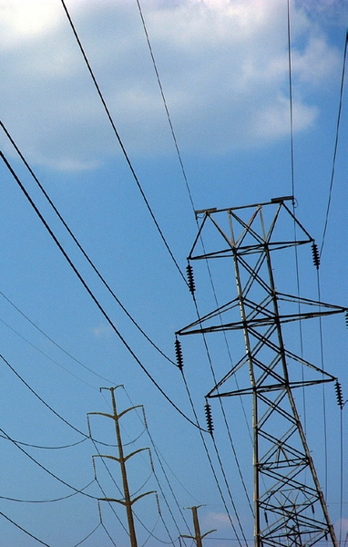 Photo of powerlines and blue sky