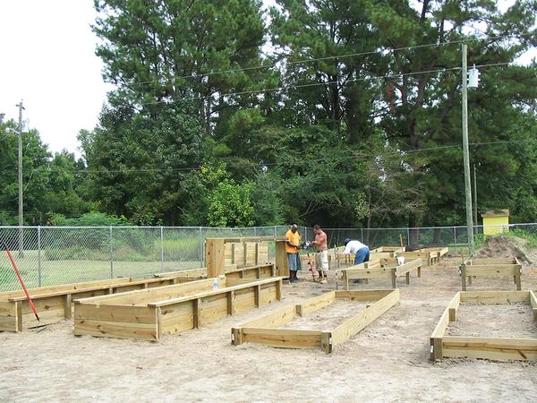 People constructing raised beds