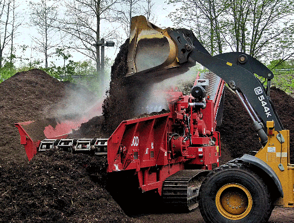 Heavy machinery in large scale compost operation.