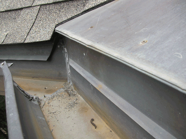Top view of segment of debris-free aluminum gutter.