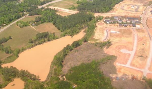 Aerial photo of a pond showing effects of turbidity.