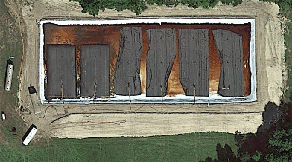 Aerial photo of geotextile sludge bags in lined basin