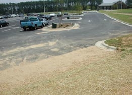 Parking area with sediment spread over pavement