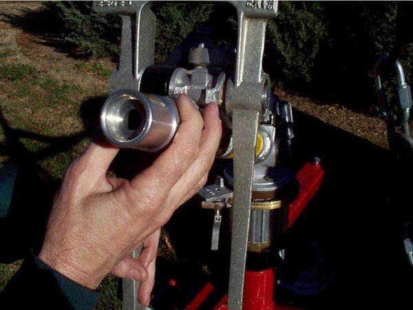 Closeup view of someone checking a nozzle.