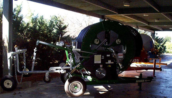 A traveler parked in a covered equipment parking area.