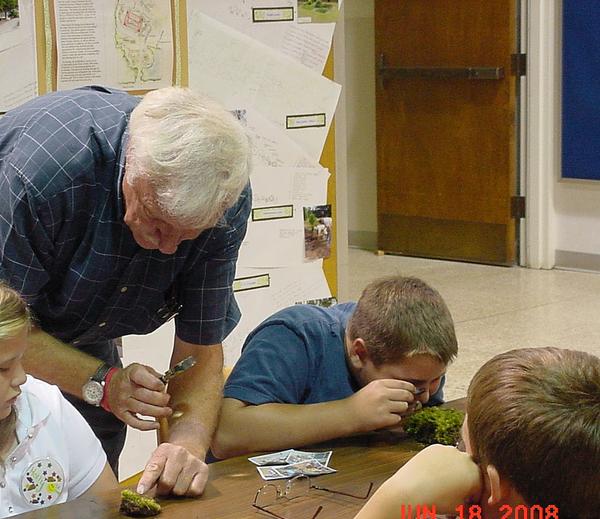 Photo of master gardener working with youth in Nash County