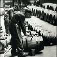 Men work with vinegar barrels