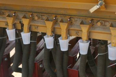 Figure 2. Collection cups attached to the drill at the row opene