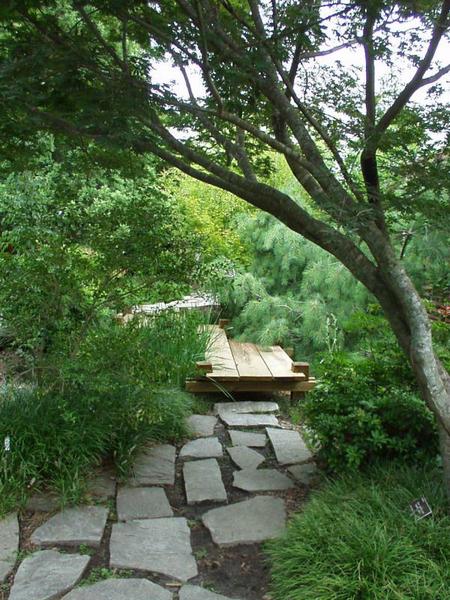 stone path joins with wooden platform