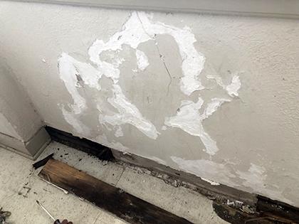 Leak around window caused paint to peal underneath.