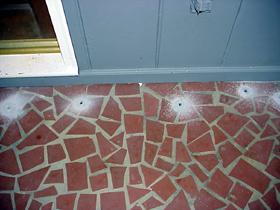 holes drilled in top of earth-filled porch