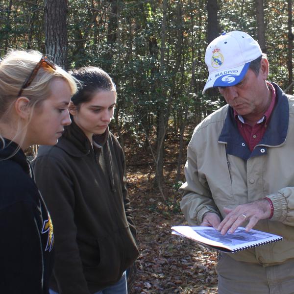 A professional forester consults with landowners